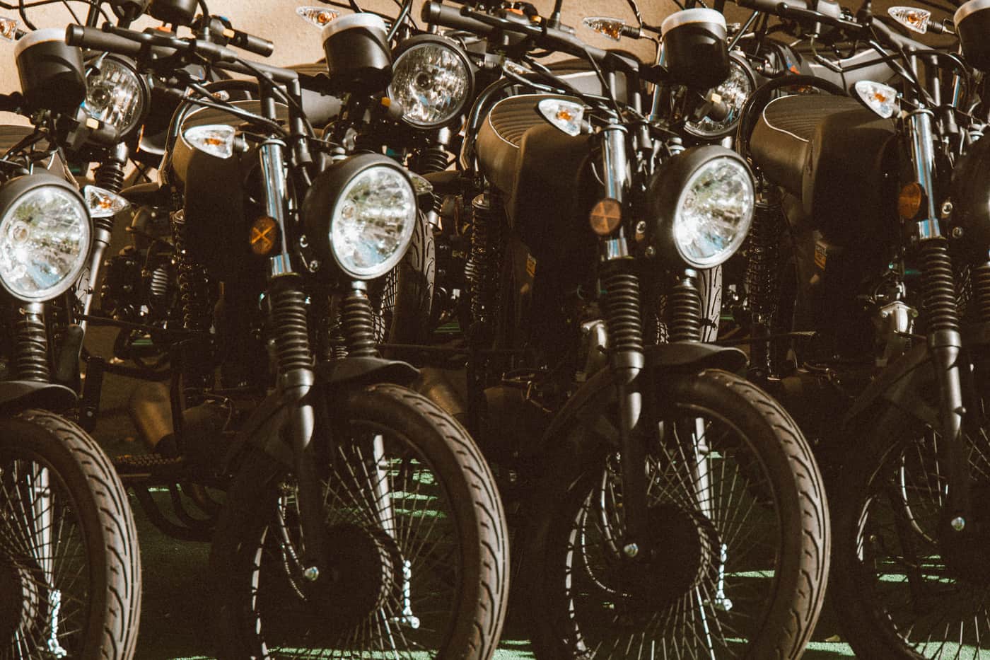 A row of classic vintage motorcycles on display