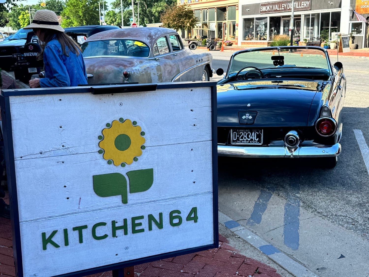 The Kitchen 64 sidewalk sign on Washington Street in downtown Marquette, Kansas