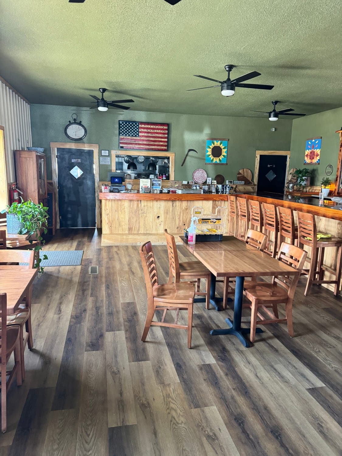 The warm, wood-trimmed dining room at Kitchen 64 in downtown Marquette, Kansas